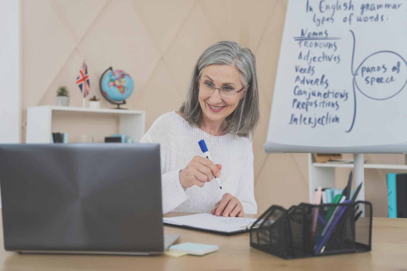 Student analyzing investment decision patterns on laptop with charts and financial data